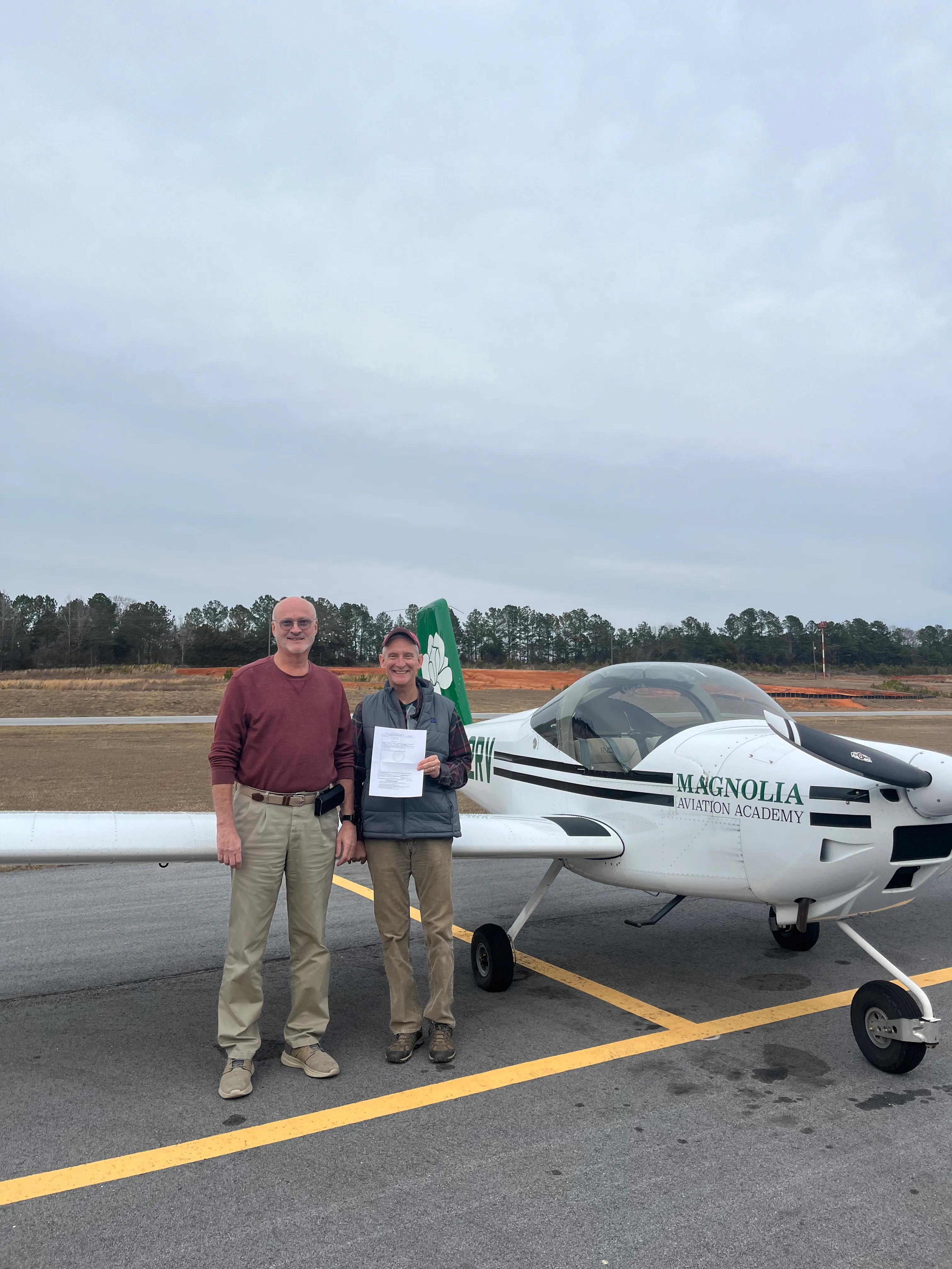Magnolia Aviation flight training cohort students on the flight line