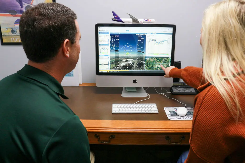 Magnolia Aviation Academy instructor reviewing a training program